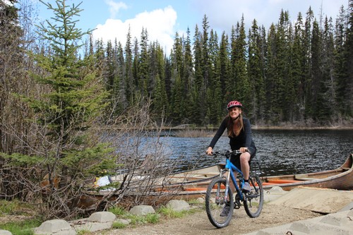 Nancy at McGillivray Lake bike trail - photo by BestSunPeaks.com