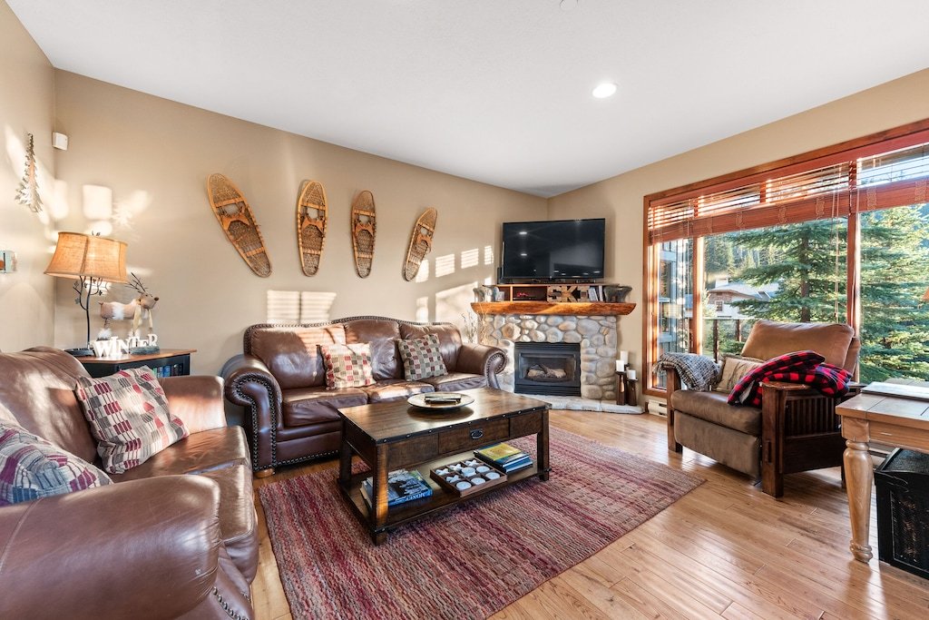 Spacious Trapper's Landing Living Room with gas fireplace